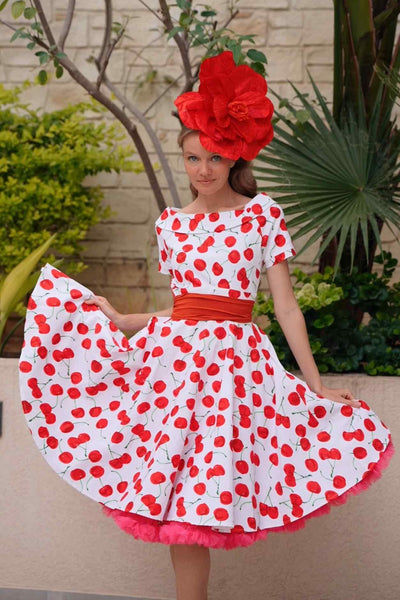 A lady wearing a Red Cherry Dress In White