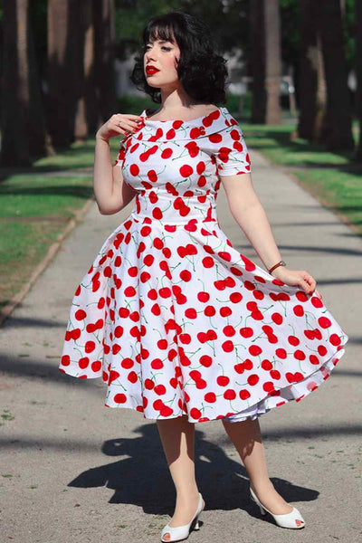 A lady wearing a Red Cherry Dress In White