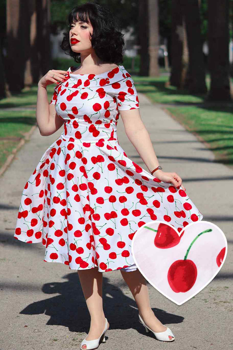A lady wearing a Red Cherry Dress In White