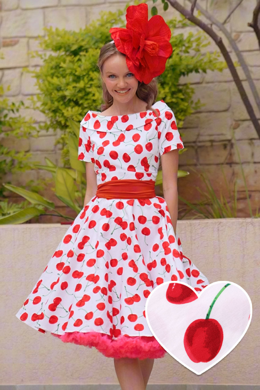 A lady wearing a Red Cherry Dress In White