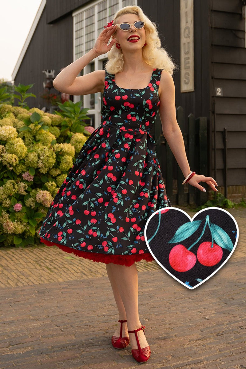 A model wearing a Red Cherry Pleated Circle Dress In Black