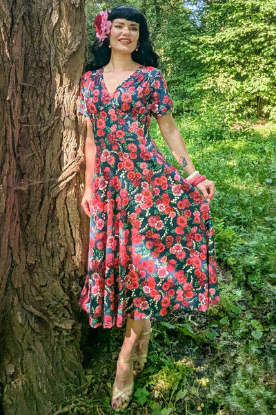 A model in Red Floral Midi Dress In Petrol Blue
