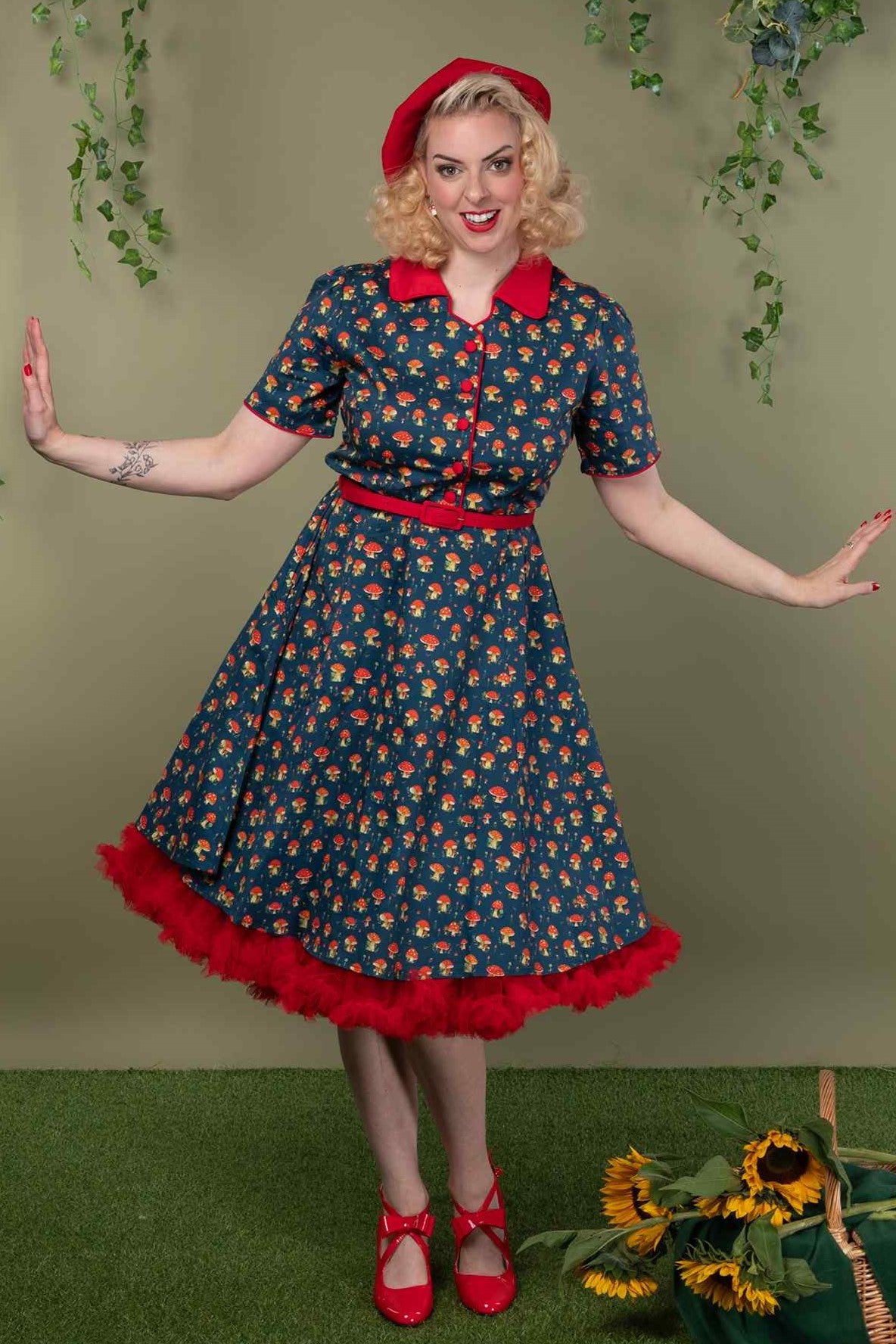 A model wearing a Red Mushroom Shirt Dress in Blue