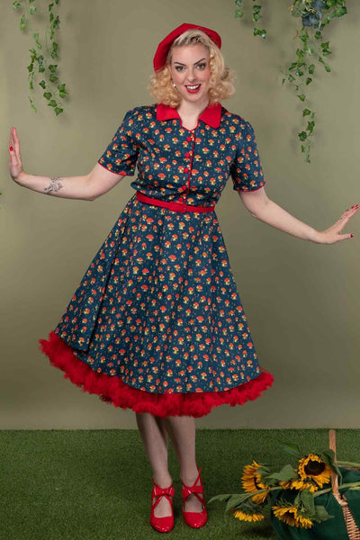 A model wearing a Red Mushroom Shirt Dress in Blue