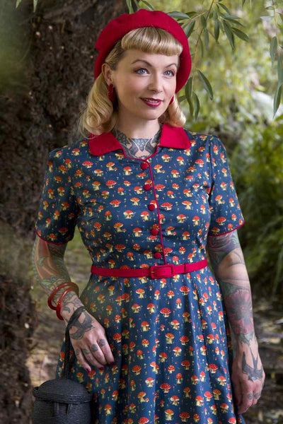 A model wearing a Red Mushroom Shirt Dress in Blue