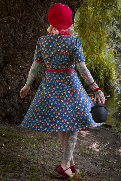 A model wearing a Red Mushroom Shirt Dress in Blue