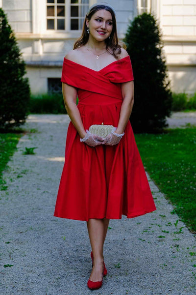 A lovely model wearing a Beverly Red Off Shoulder Dress