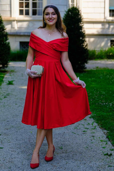 A model wearing a Beverly Red Off Shoulder Dress