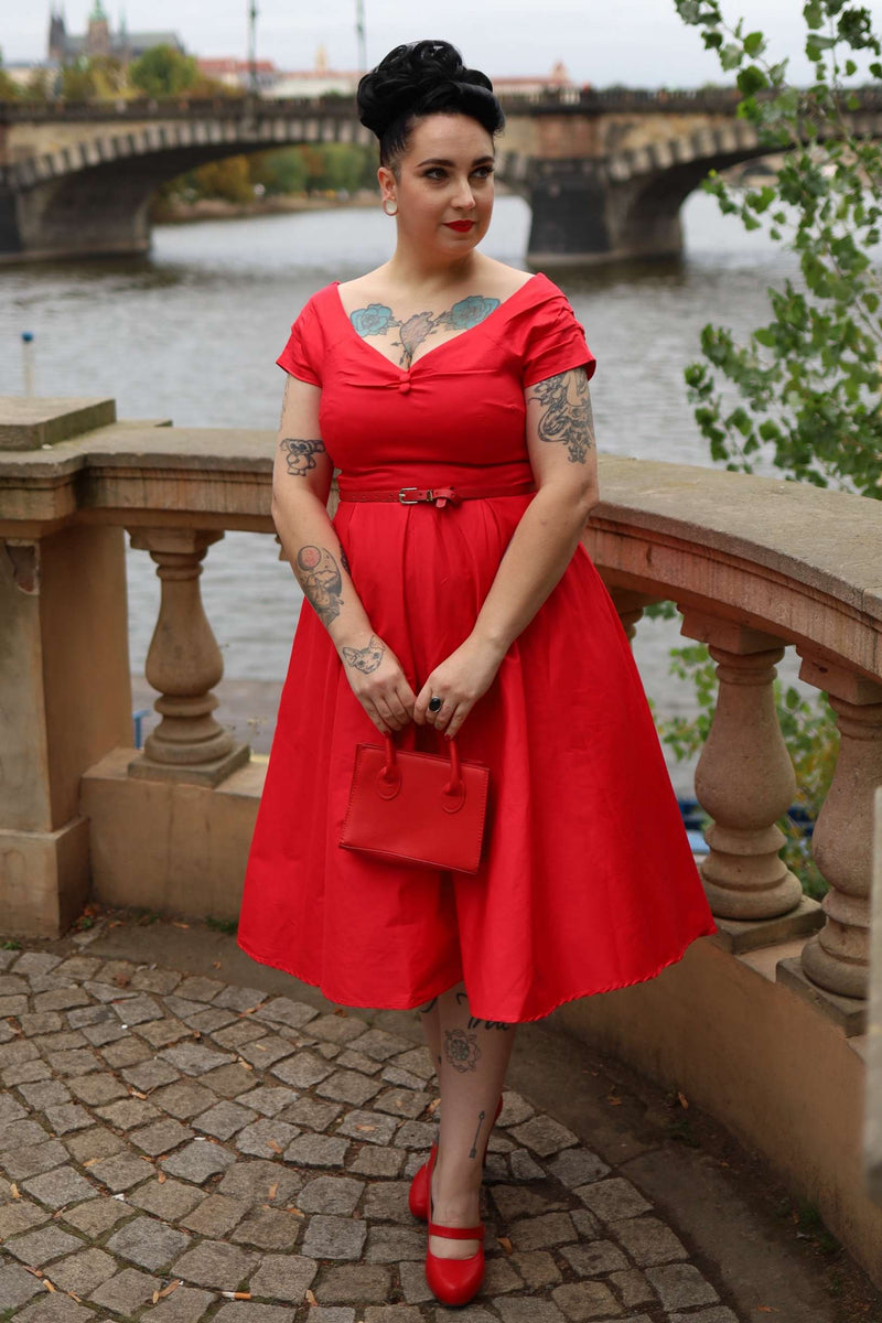 A model wearing a Lily Red Off Shoulder Midi Dress