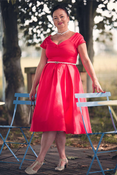 A lady wearing a Lily Red Off Shoulder Midi Dress