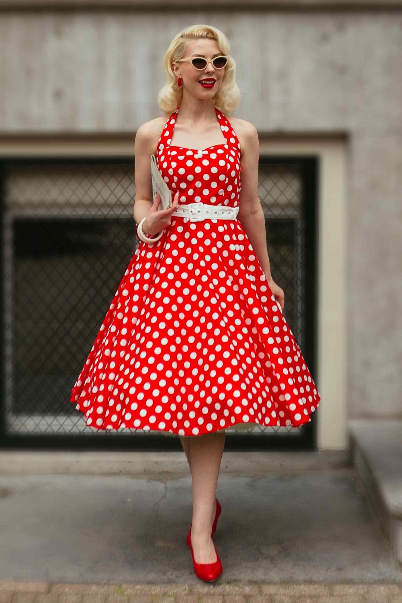 A lady wearing a Red Polka Dot Halter Dress