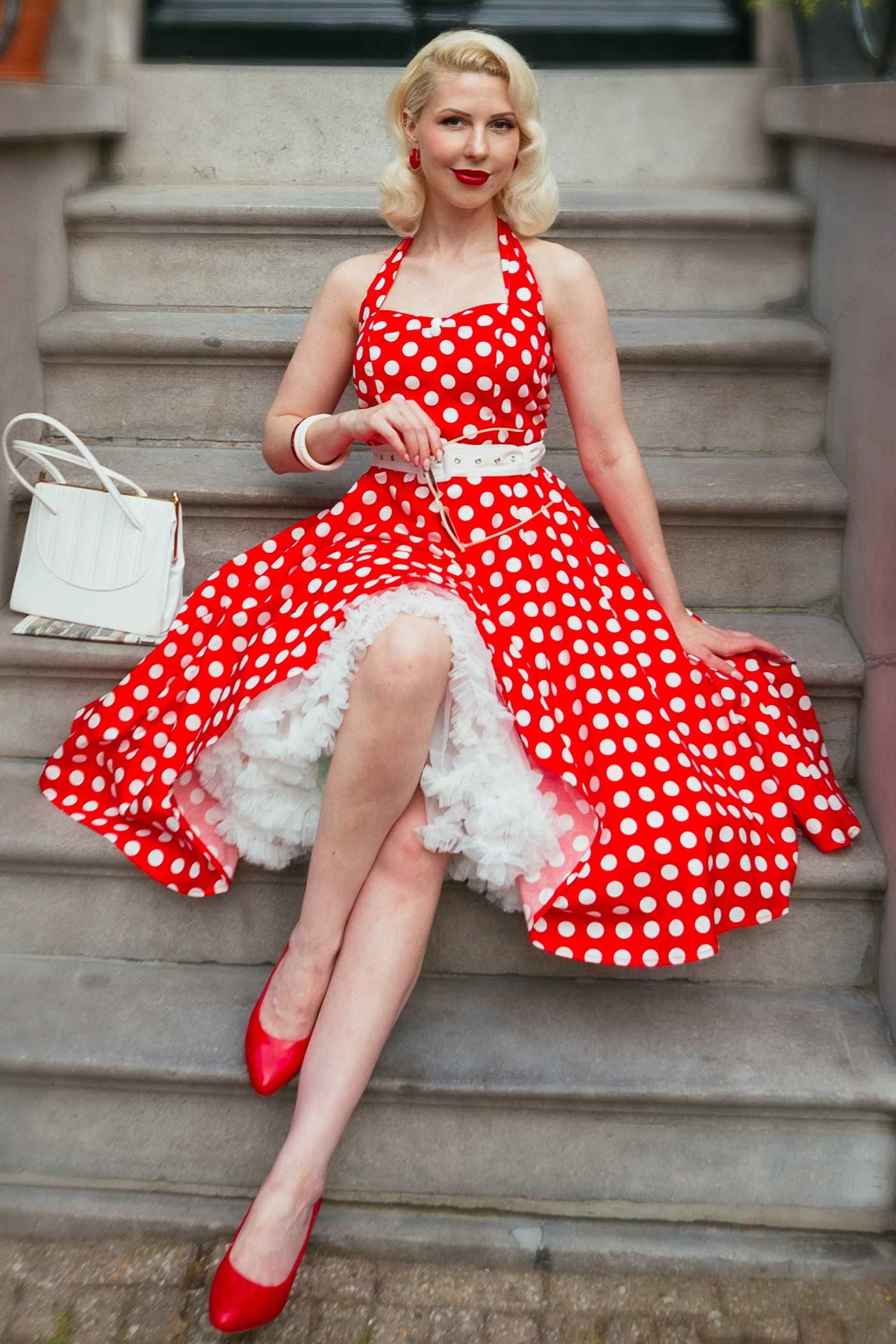 A model wearing a Red Polka Dot Halter Dress
