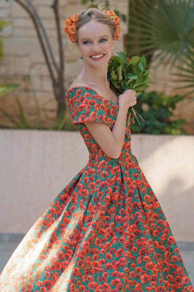 A lady wearing a Red Poppy Garden Off Shoulder Dress