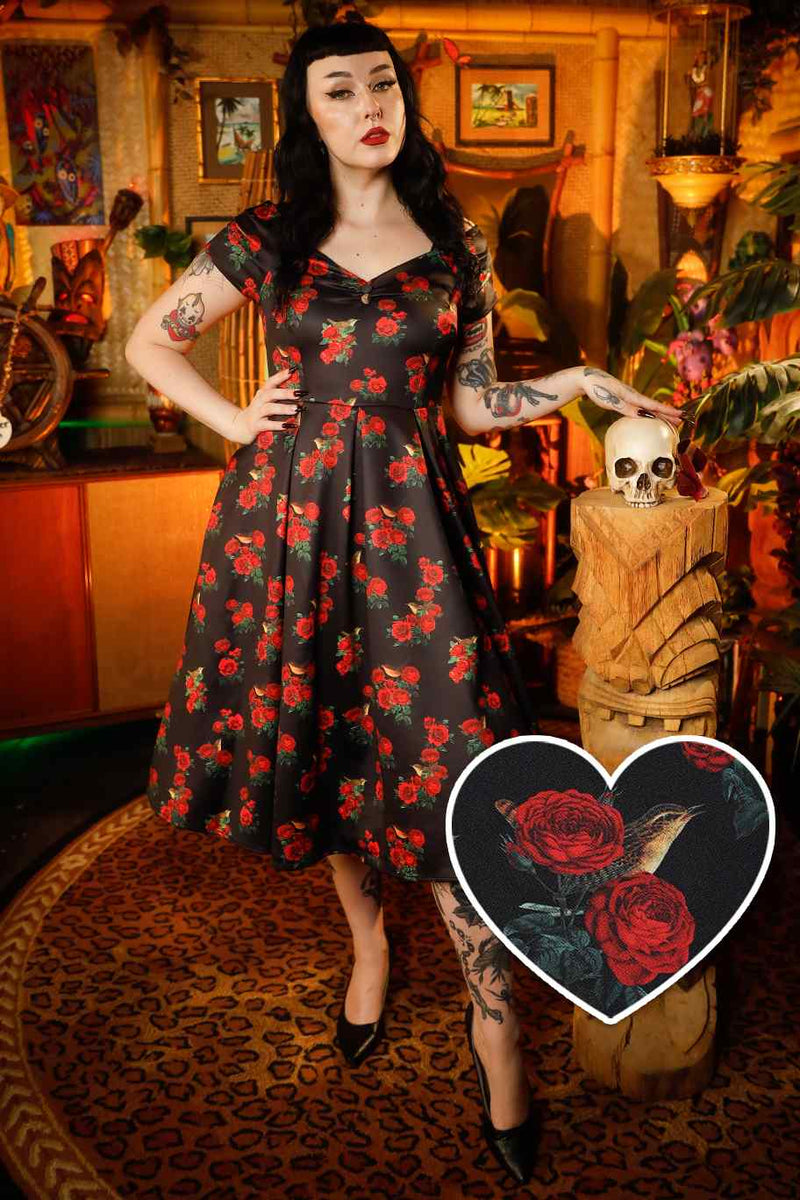 A lady wearing a Red Rose & Bird Off Shoulder Dress In Black