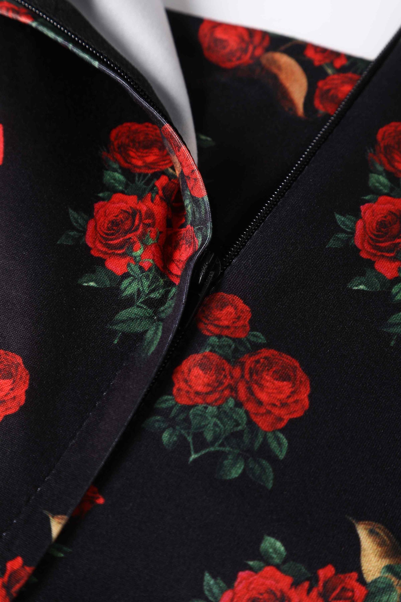 Close up View of Red Rose and Bird Cap Sleeved Swing Dress in black