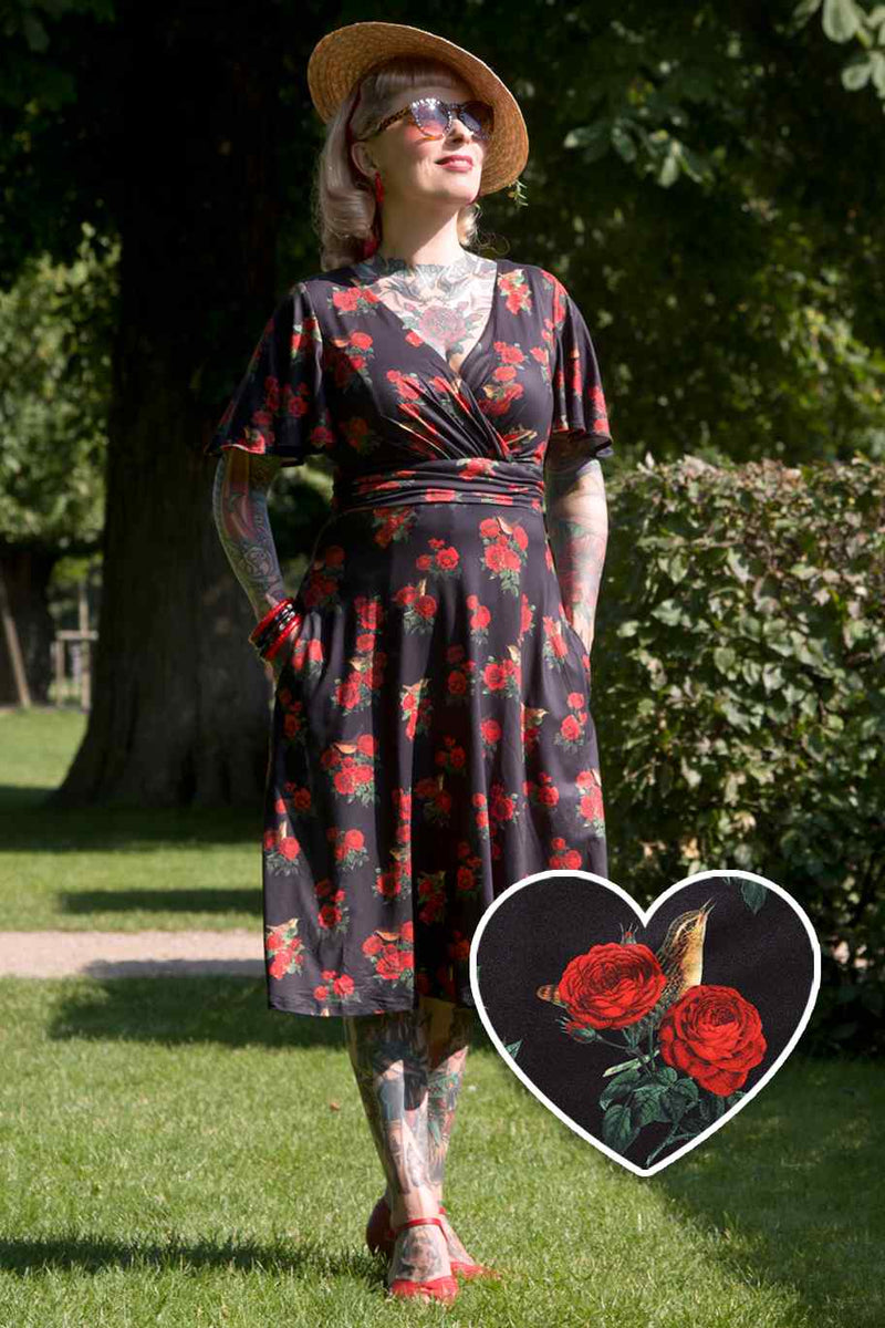 A model wearing Red Rose Crossover Bust Dress