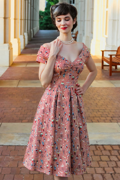 A lady in Red Striped Circus Off Shoulder Dress