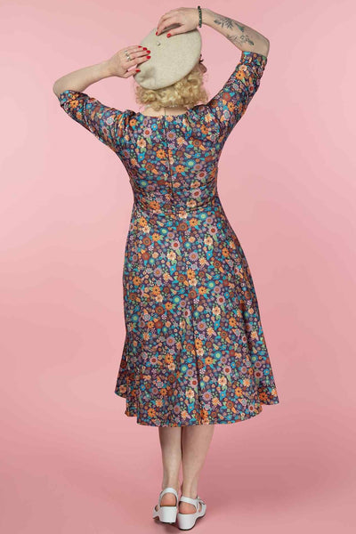 A model wearing a Retro 70s Floral Garden Dress