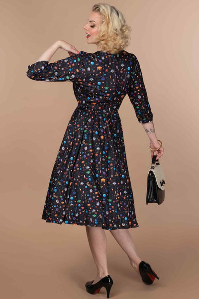 A lady wearing a Retro Game Print Dress In Black