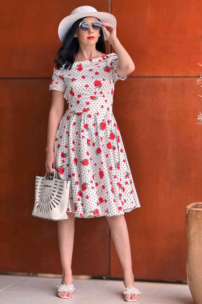 A lady wearing a Retro Heart & Rose Dress
