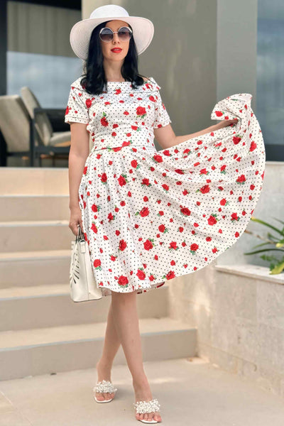 A lady wearing a Retro Heart & Rose Dress