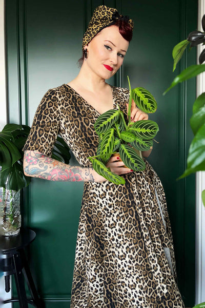 A lady wearing a Retro Leopard Print Casual Wrap Dress