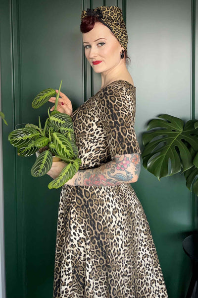 A lady wearing a Retro Leopard Print Casual Wrap Dress