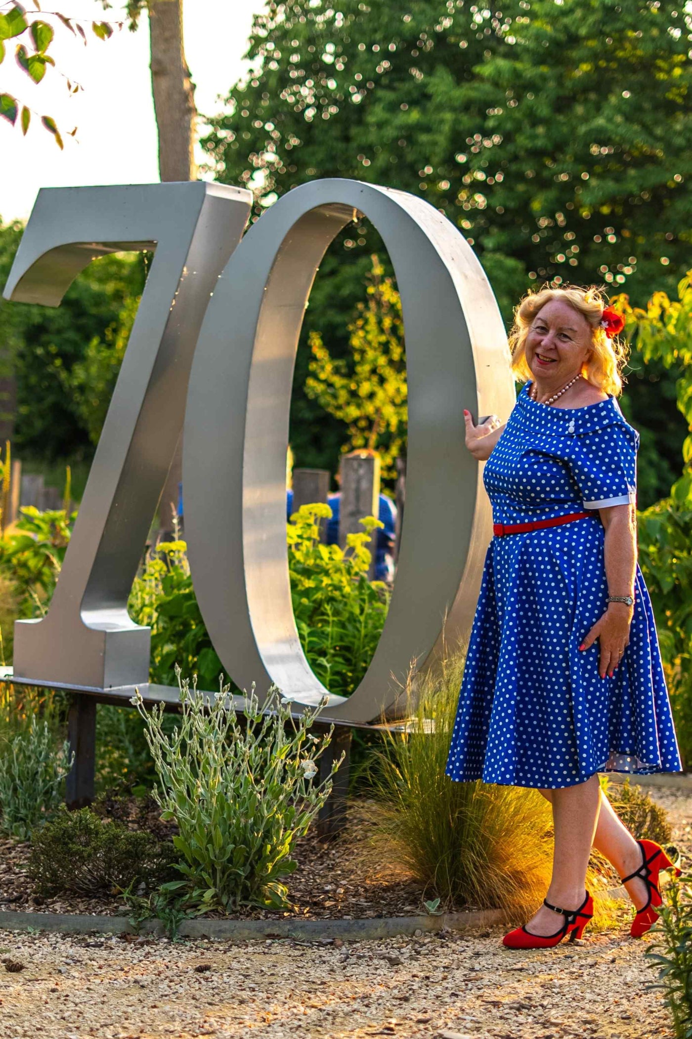 Model wearing Retro Polka Dot Swing Dress in Dark Blue