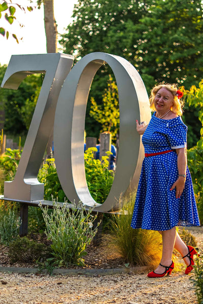 Model wearing Retro Polka Dot Swing Dress in Dark Blue