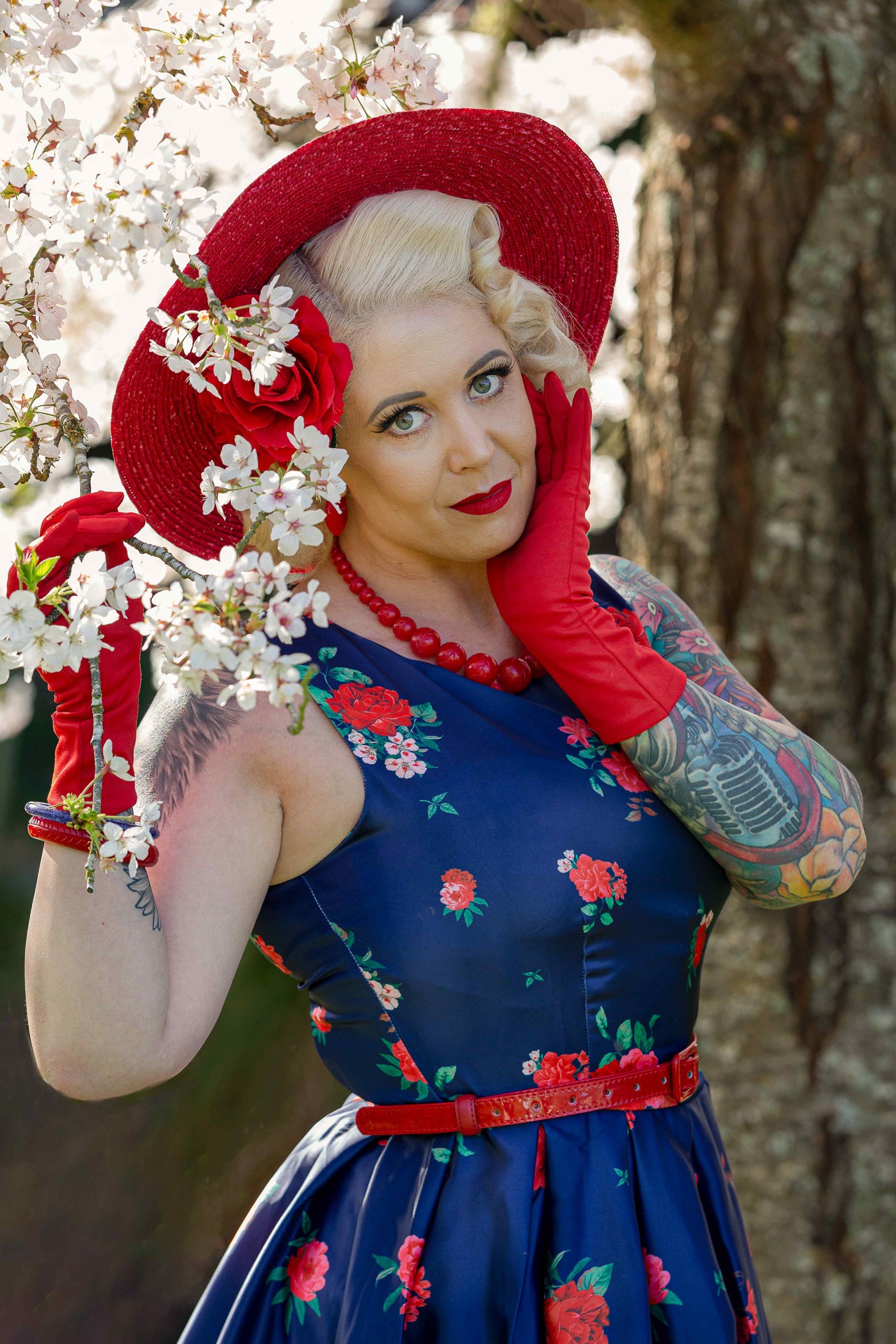 A model wearing Retro Swing Dress in Purple with Raising Rose Print