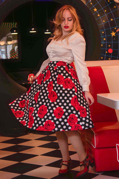A lady wearing a Retro Swing Skirt in Roses & Polka Dots