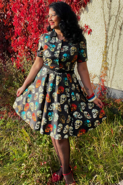 A model wearing a Rockabilly Black Skull Shirt Dress