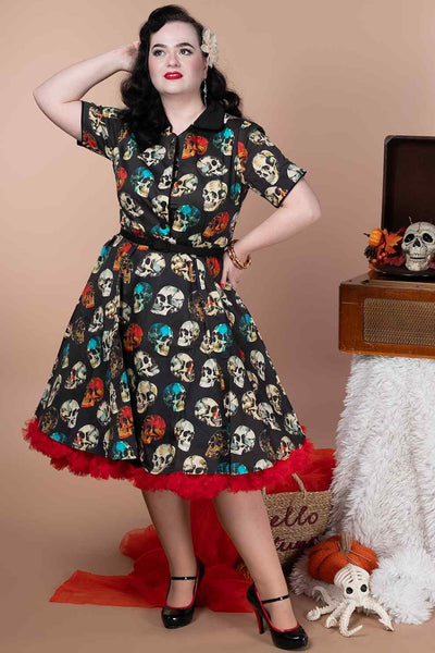 A lady wearing a Rockabilly Black Skull Shirt Dress
