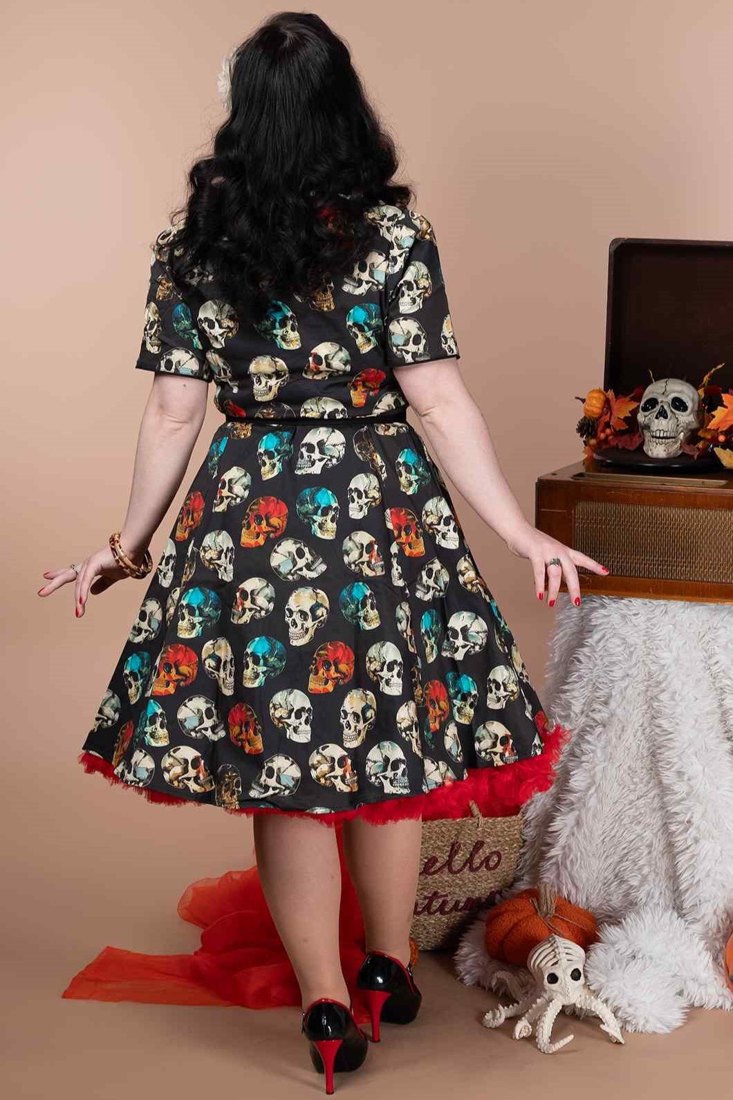 A model wearing a Rockabilly Black Skull Shirt Dress