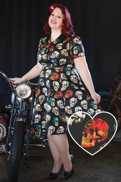 A model wearing rockabily black skull shirt dress