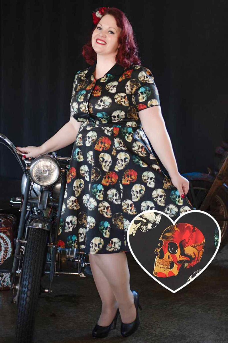 A model wearing rockabily black skull shirt dress