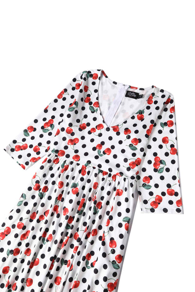 Close up view of Rockabilly Cherry Polka Dot Print Dress in White