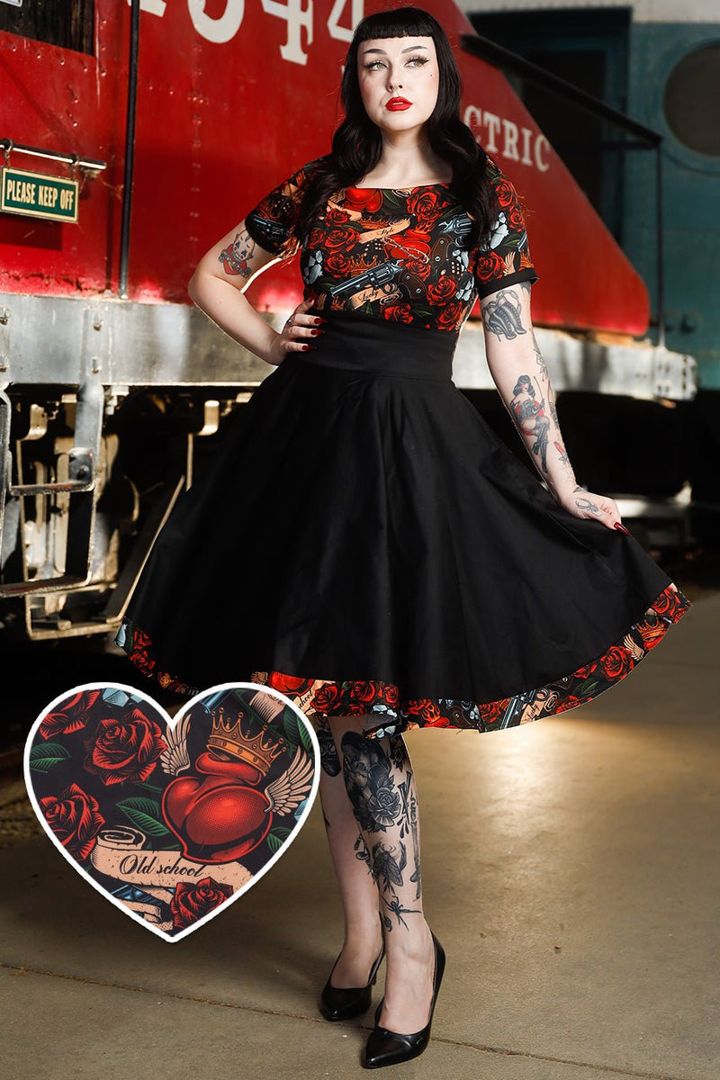 A model wearing Rockabilly Guns N Roses Roll Collar Dress