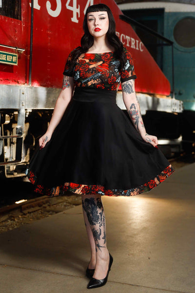 Front view of model wearing Rockabilly Guns N Roses Roll Collar Dress