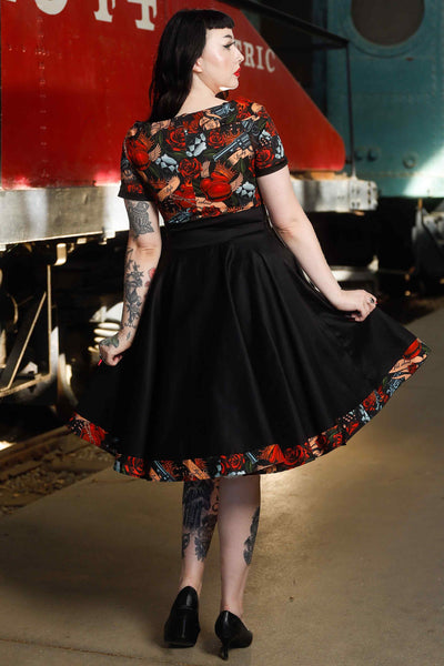 Back view of model wearing Rockabilly Guns N Roses Roll Collar Dress