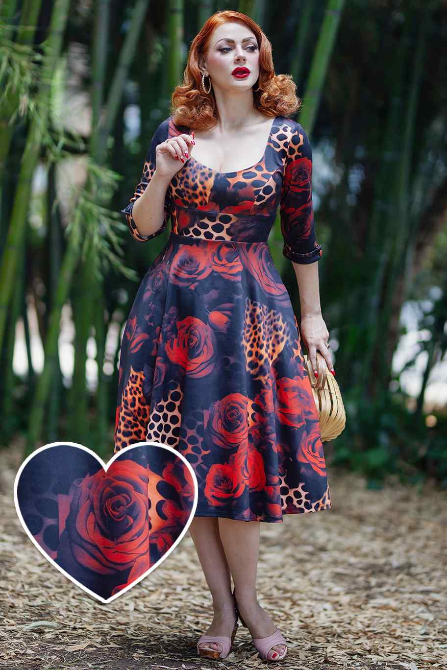 A model wearing a ockabilly Leopard Rose Midi Dress