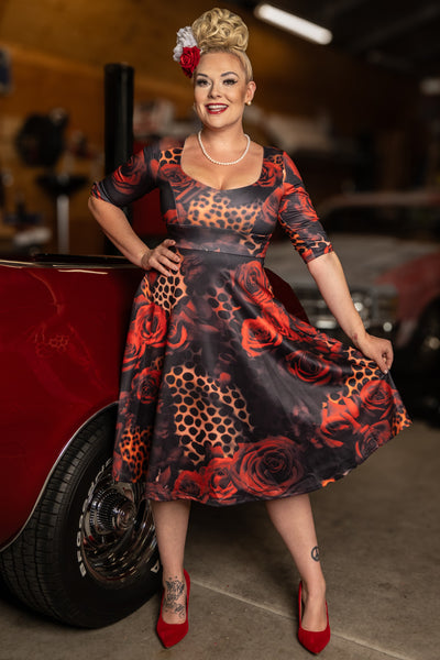A model wearing a Rockabilly Leopard Rose Midi Dress