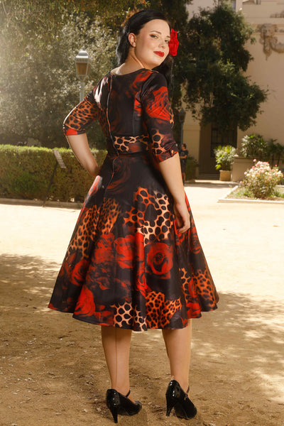 Model wearing a Rockabilly Leopard Rose Midi Dress