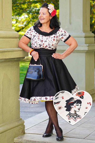 A lady wearing a Rockabilly Old School Tattoo Roll Collar Dress