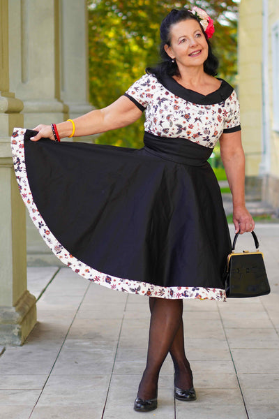 A lady wearing a Rockabilly Old School Tattoo Roll Collar Dress
