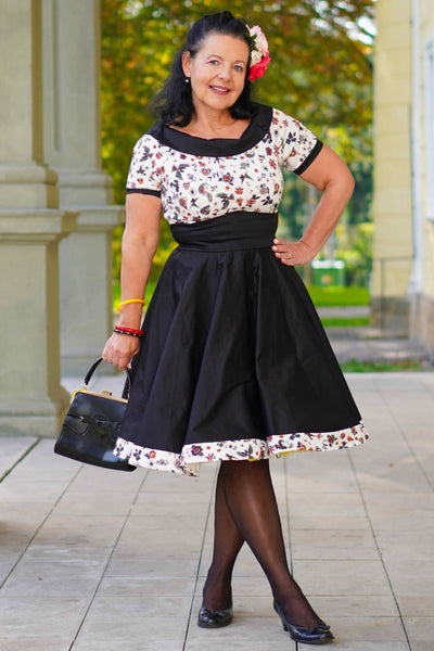 A lady wearing a Rockabilly Old School Tattoo Roll Collar Dress