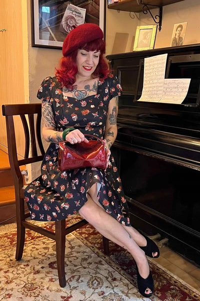 A model wearing Rockabilly Skull & Rose Dress