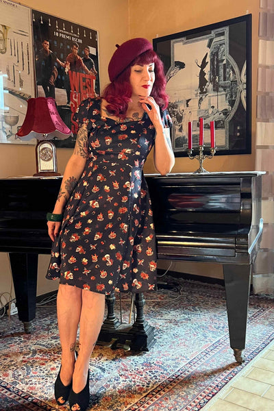 A model wearing Rockabilly Skull & Rose Dress