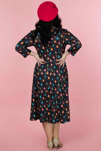 A model wearing a Rockstar Black Long Sleeved Dress
