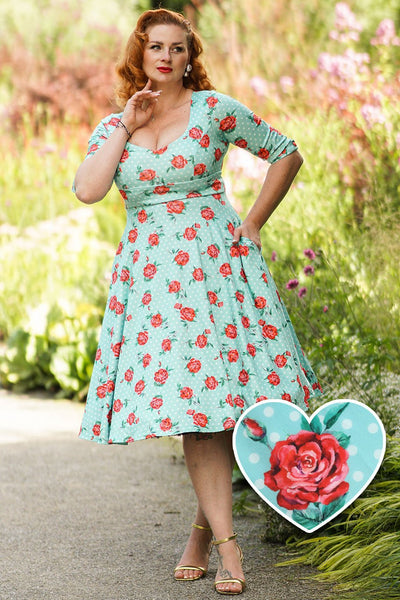 A model wearing a Rose Baby Blue Midi Dress